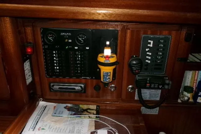 Slide: The Image of Control panel of a 2000 Bavaria Yachts sloop with navigation and communication equipment. - 5