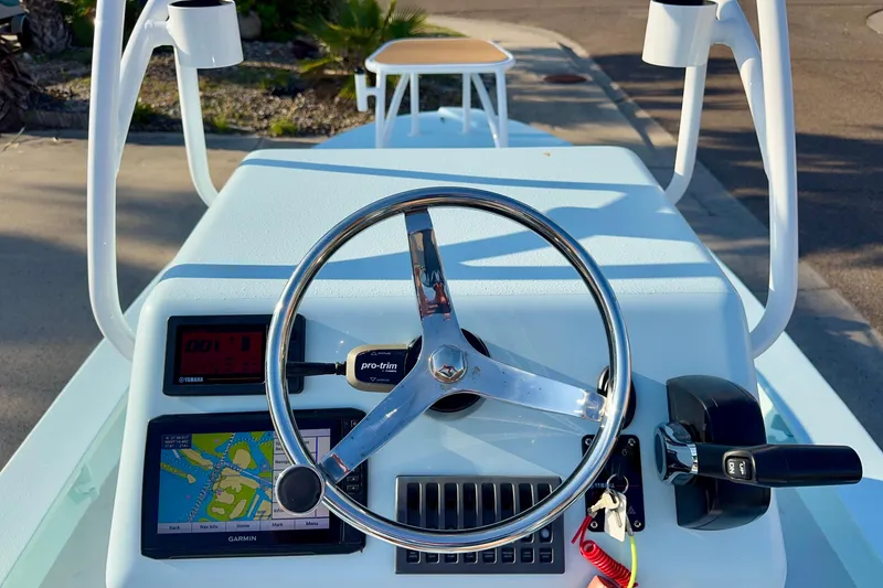 Slide: The Image of Steering console of 2023 Waterman Wildwater 23 boat with navigation equipment. - 11