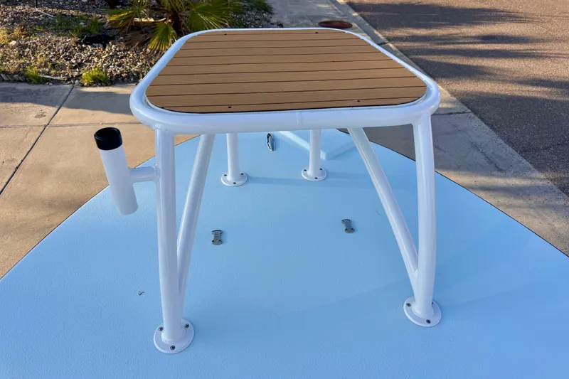 Slide: The Image of Waterman Wildwater 23 boat platform, 2023 model, featuring a sturdy white frame and wooden deck. - 29