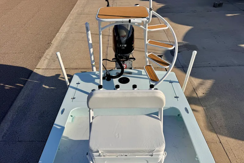 Slide: The Image of 2023 Waterman Wildwater 23 boat with spiral staircase and outboard motor. - 35