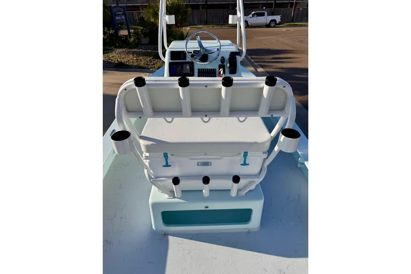 Slide: The Image of 2023 Waterman Wildwater 23 boat interior with rod holders and steering console. - 38