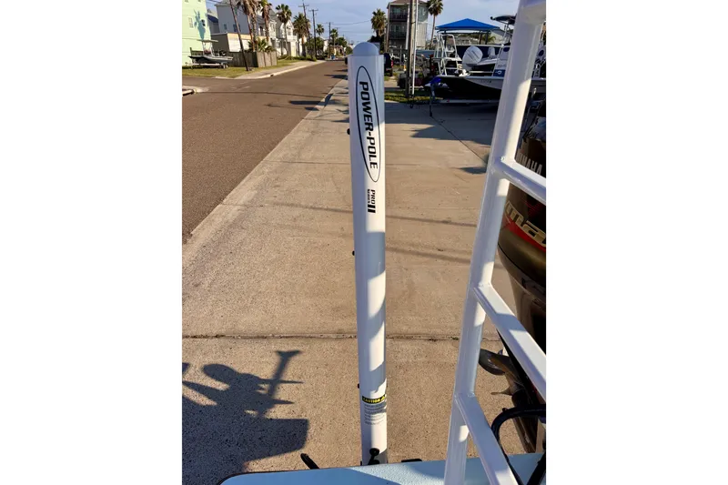 Slide: The Image of Power-Pole anchor on Waterman Wildwater 23 boat, 2023 model, parked on a sunny street. - 39