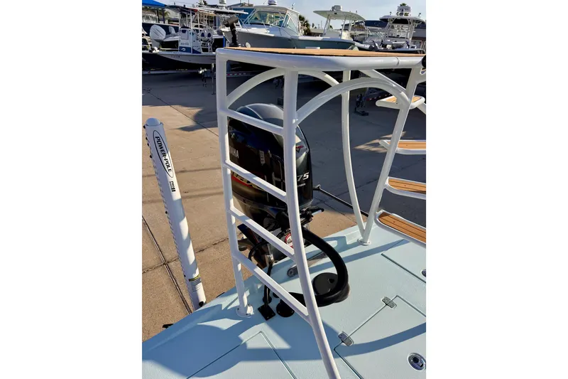 Slide: The Image of Waterman Wildwater 23 boat, 2023 model, featuring a Yamaha engine and Power-Pole anchor system. - 40