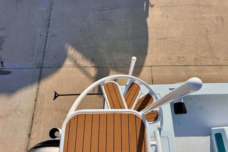 Slide: The Image of Top view of a 2023 Waterman Wildwater 23 boat with wooden deck details. - 43