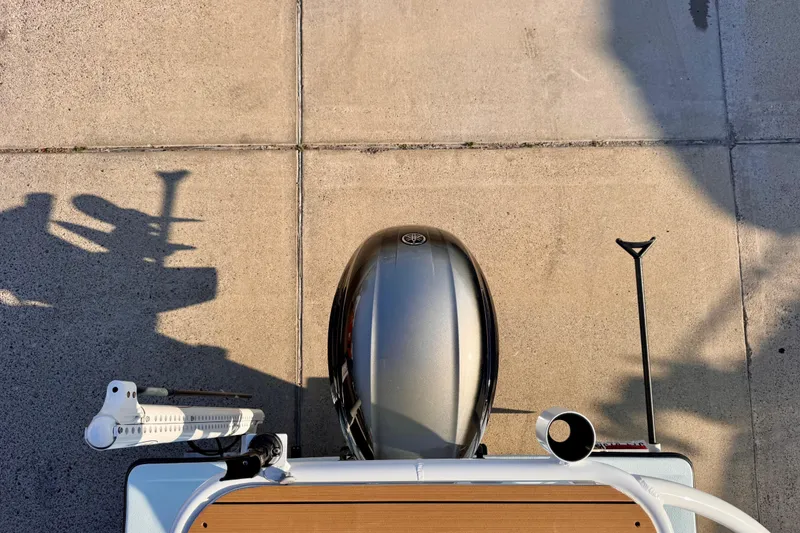 Slide: The Image of Top view of a 2023 Waterman Wildwater 23 boat engine and deck on concrete. - 47