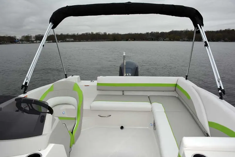 Slide: The Image of Manufacturer Provided Image: 2022 Starcraft SVX 171 OB boat interior with green accents on a lake. - 6