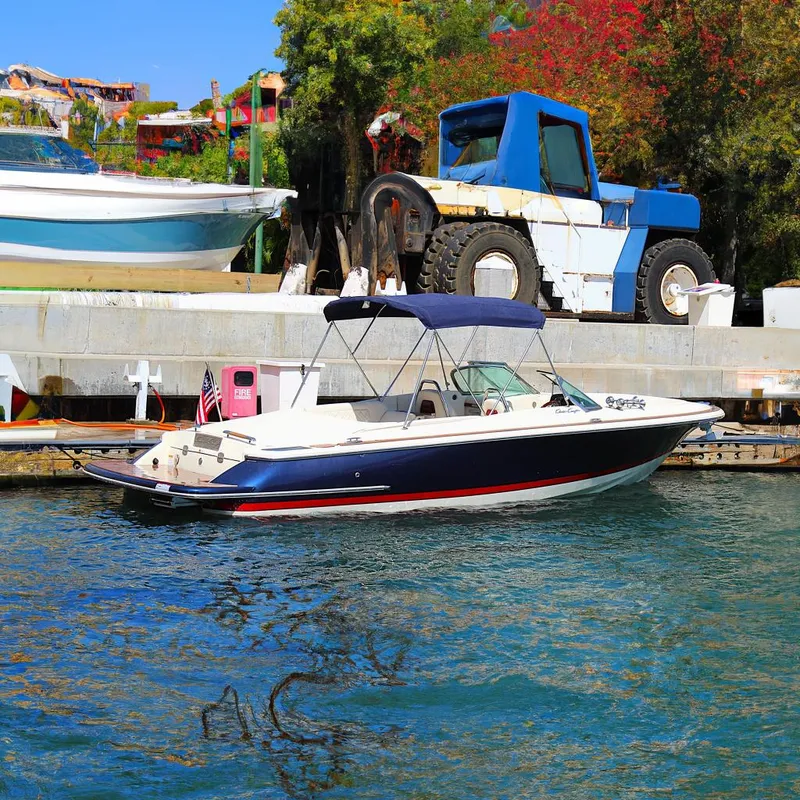 The Image of 2022 Chris-Craft Launch 27 boat docked, featuring a sleek design and blue canopy. - 0
