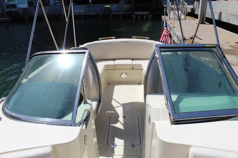 Slide: The Image of 2022 Chris-Craft Launch 27 boat interior with open cockpit and American flag. - 11