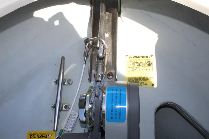 Slide: The Image of Close-up of 2022 Chris-Craft Launch 27 boat mechanism with warning labels. - 18