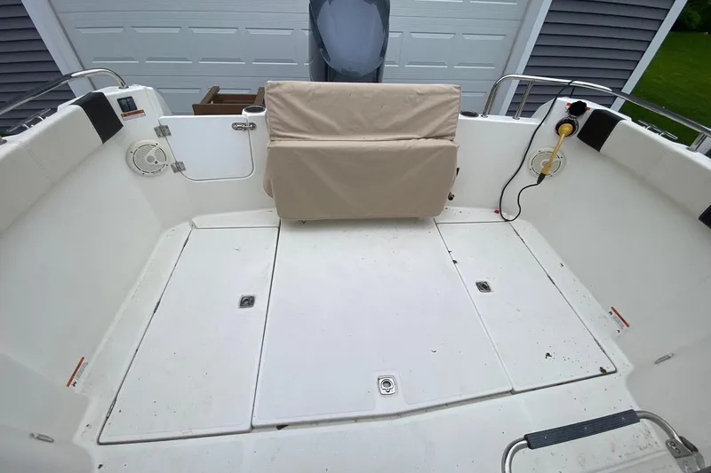 Slide: The Image of 2016 Cutwater C-24 boat deck with seating and storage compartments. - 23