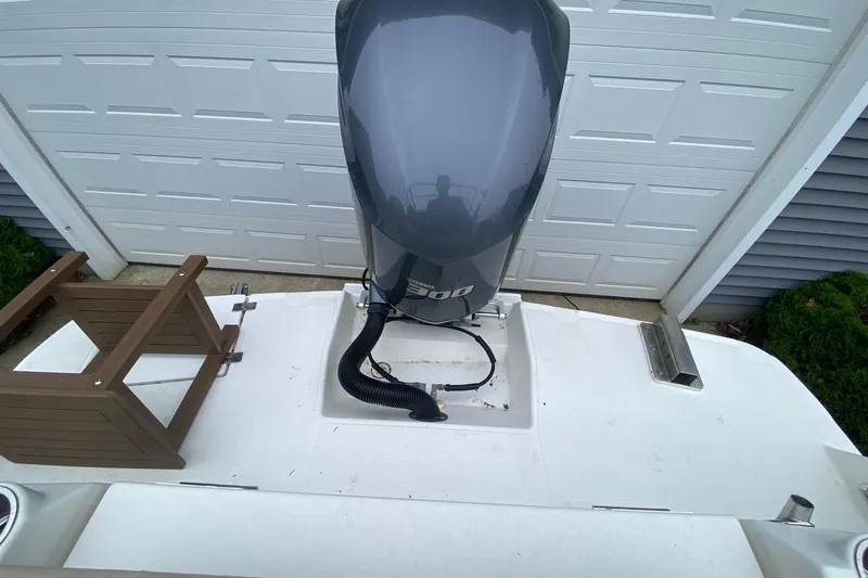Slide: The Image of 2016 Cutwater C-24 boat with Yamaha 300 outboard motor in a garage setting. - 25