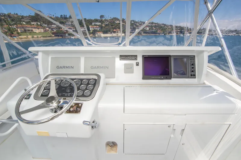 Slide: The Image of Helm of 2001 Hatteras 55 Convertible yacht with Garmin navigation systems. - 13