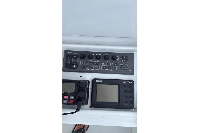 Slide: The Image of Control panel of a 2001 Hatteras 55 Convertible yacht with navigation equipment. - 12