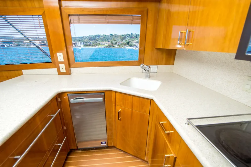 Slide: The Image of Luxurious kitchen interior of 2001 Hatteras 55 Convertible yacht with ocean view. - 26