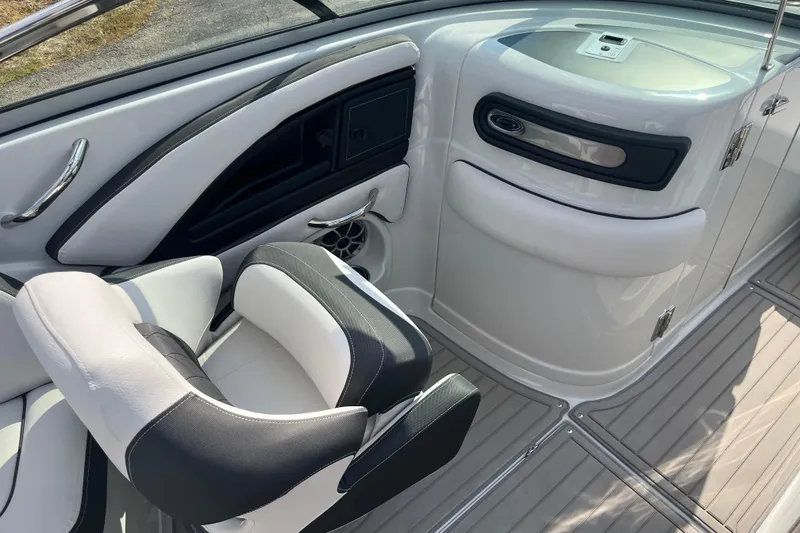 Slide: The Image of 2025 Crownline Eclipse E235 boat interior with sleek seating and modern design. - 16