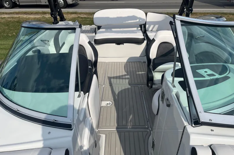 Slide: The Image of 2025 Crownline Eclipse E235 boat interior with sleek seating and modern design. - 22