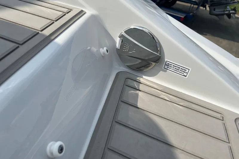 Slide: The Image of 2025 Crownline Eclipse E235 boat deck with water system control. - 4