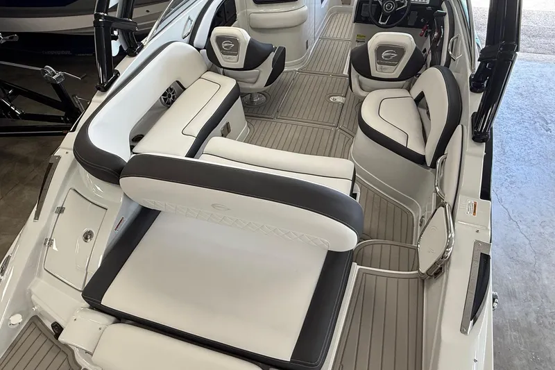 Slide: The Image of 2025 Crownline Eclipse E235 boat interior with luxurious seating and modern design. - 7