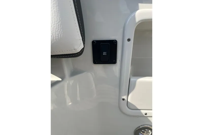 Slide: The Image of 2025 Crownline Eclipse E235 boat seat back switch detail. - 8