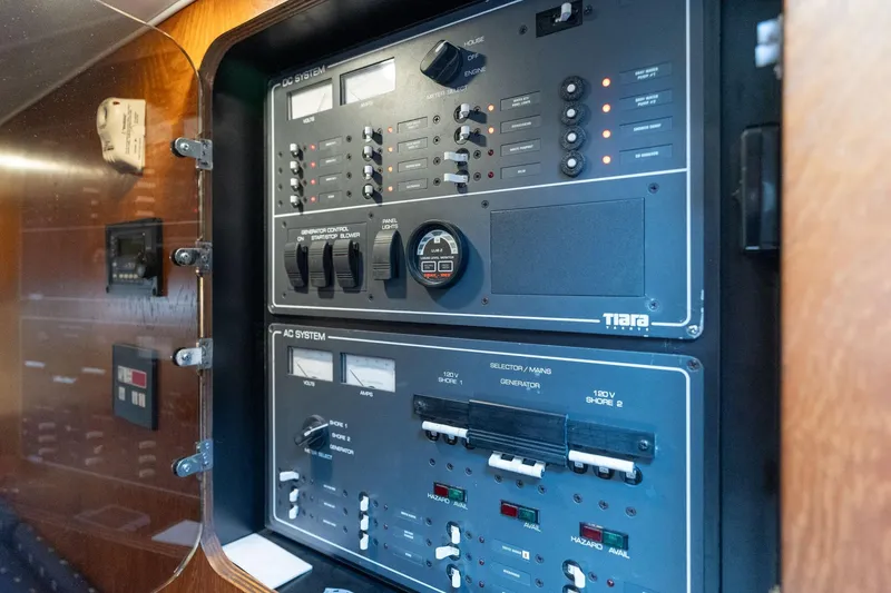 Slide: The Image of Electrical control panel inside a 1998 Tiara Yachts 3500 Express boat. - 26