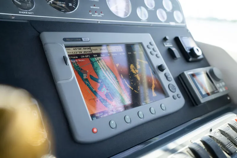 Slide: The Image of Navigation system on 1998 Tiara Yachts 3500 Express dashboard, displaying nautical charts. - 33