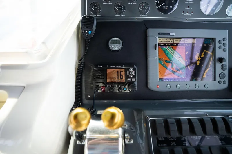 Slide: The Image of Control panel of a 1998 Tiara Yachts 3500 Express with navigation and communication equipment. - 34