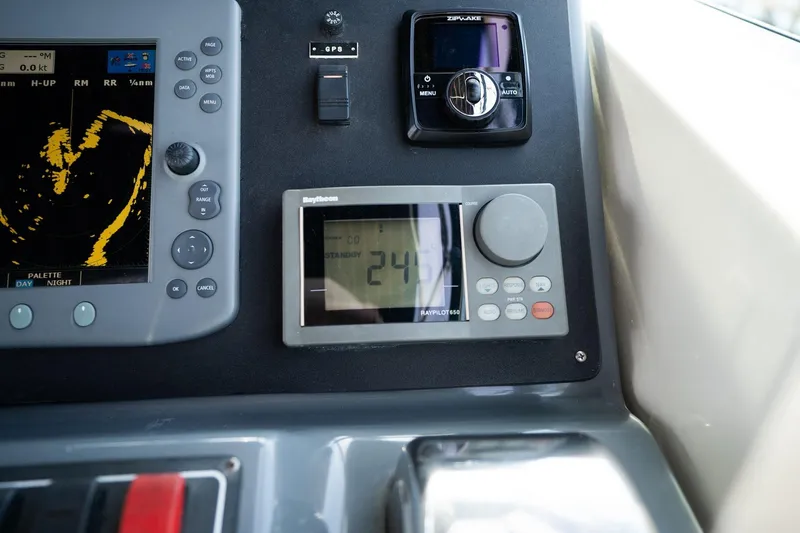 Slide: The Image of Control panel of a 1998 Tiara Yachts 3500 Express with navigation instruments. - 35
