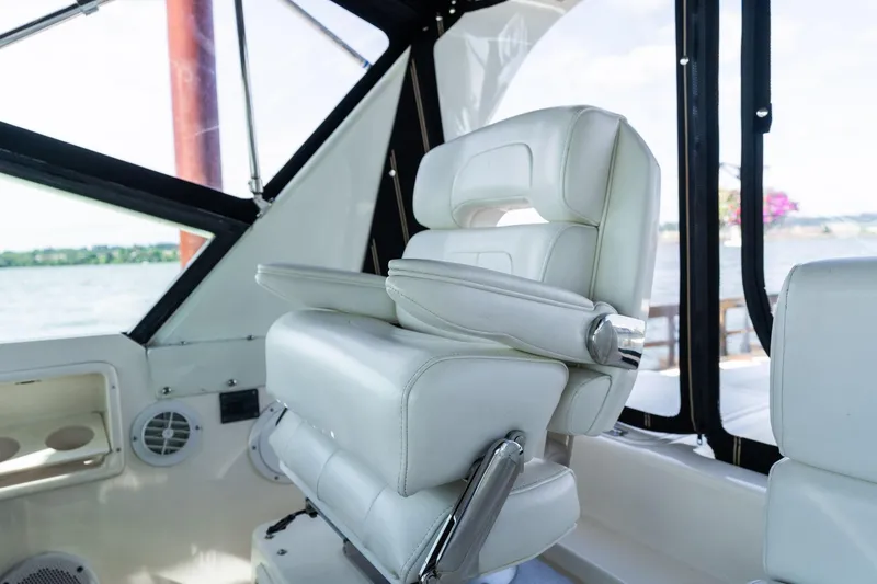 Slide: The Image of Captain's chair on a 1998 Tiara Yachts 3500 Express, overlooking the water. - 39