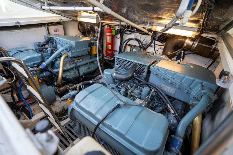 Slide: The Image of Engine room of a 1998 Tiara Yachts 3500 Express, featuring dual Caterpillar engines. - 69
