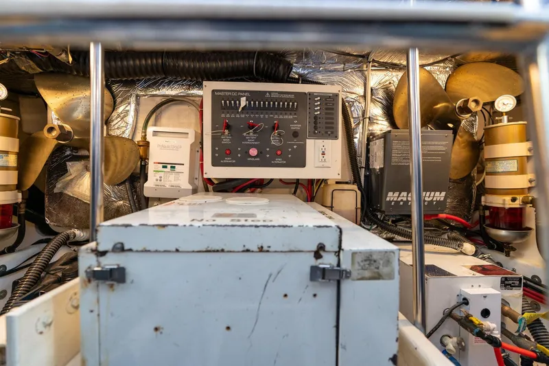 Slide: The Image of Engine room of a 1998 Tiara Yachts 3500 Express with control panel and equipment. - 70