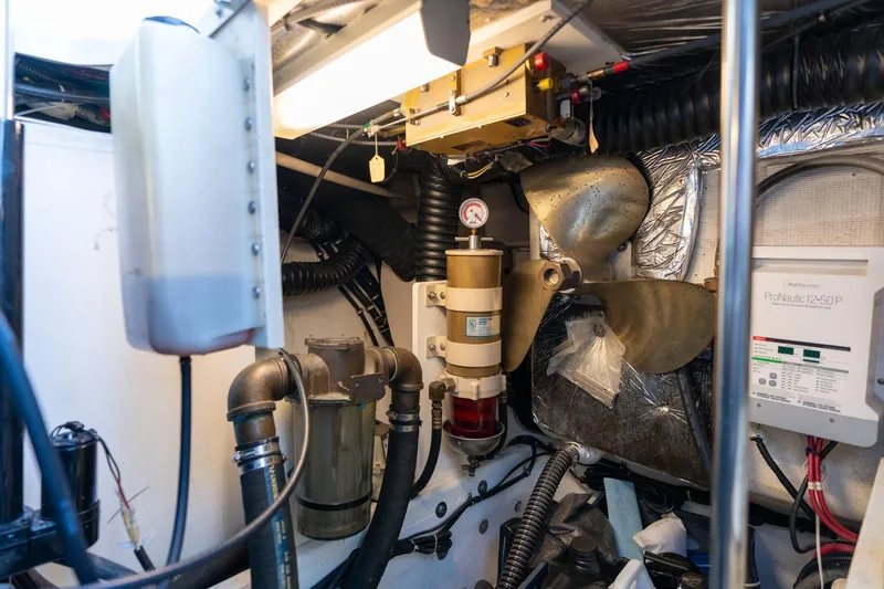 Slide: The Image of Engine room of a 1998 Tiara Yachts 3500 Express, showcasing mechanical components. - 73