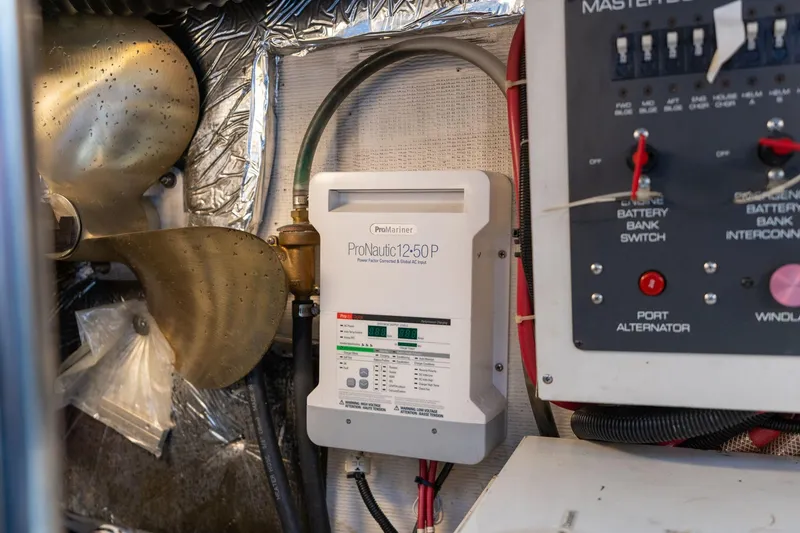 Slide: The Image of Engine room of 1998 Tiara Yachts 3500 Express with ProNautic charger and control panel. - 74