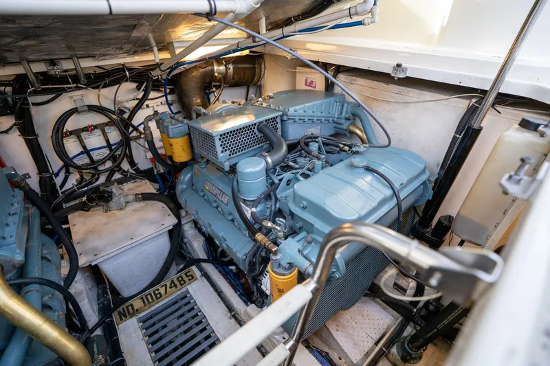 Slide: The Image of Engine room of a 1998 Tiara Yachts 3500 Express, featuring a Caterpillar engine. - 77
