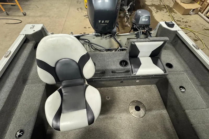 Slide: The Image of 2013 Alumacraft Competitor 175 Sport boat interior with seating and Yamaha outboard motors. - 10