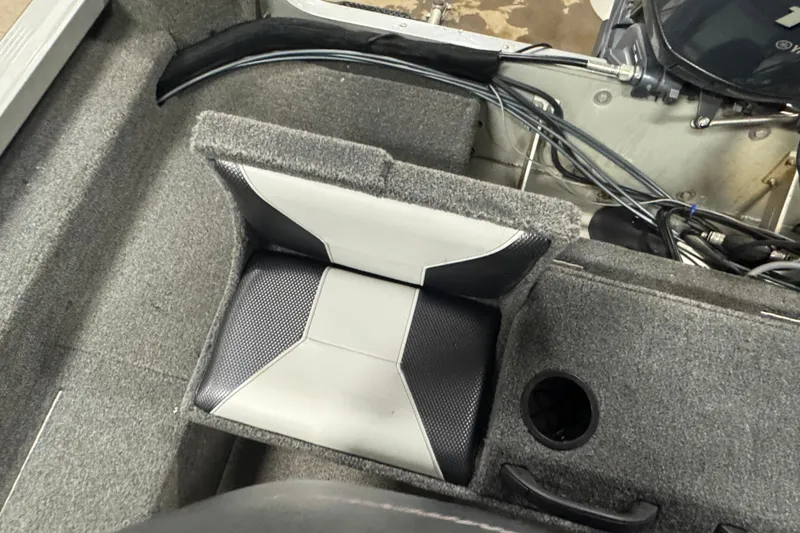 Slide: The Image of 2013 Alumacraft Competitor 175 Sport boat interior with cushioned seat and storage compartment. - 11
