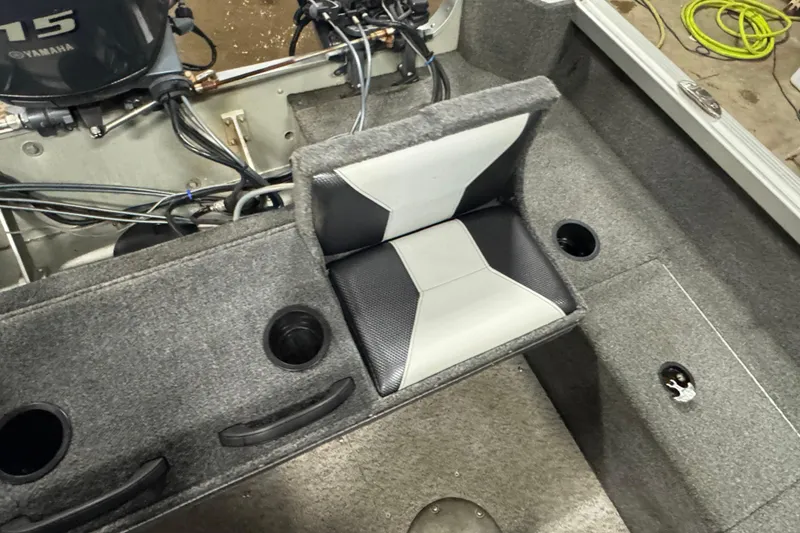 Slide: The Image of 2013 Alumacraft Competitor 175 Sport interior with seating and cup holders. - 12