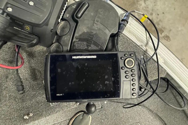 Slide: The Image of Humminbird Helix 7 fish finder on 2013 Alumacraft Competitor 175 Sport boat deck. - 16