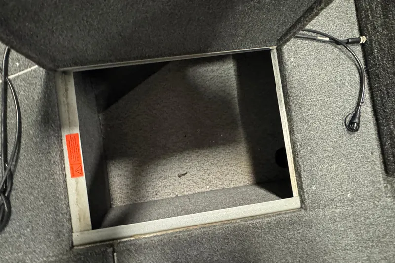 Slide: The Image of Open storage compartment in 2013 Alumacraft Competitor 175 Sport boat interior. - 19