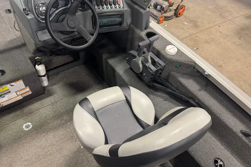 Slide: The Image of Interior of 2013 Alumacraft Competitor 175 Sport boat with steering wheel and seat. - 6