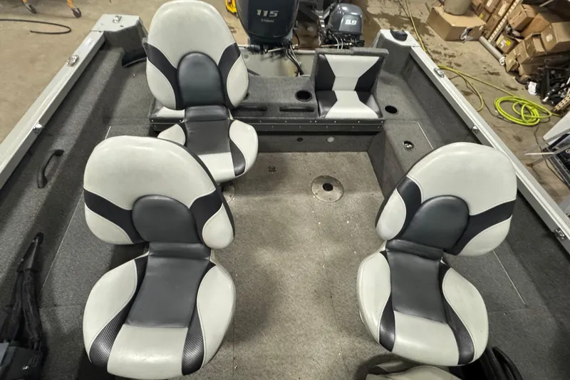 Slide: The Image of 2013 Alumacraft Competitor 175 Sport boat interior with four cushioned seats. - 9