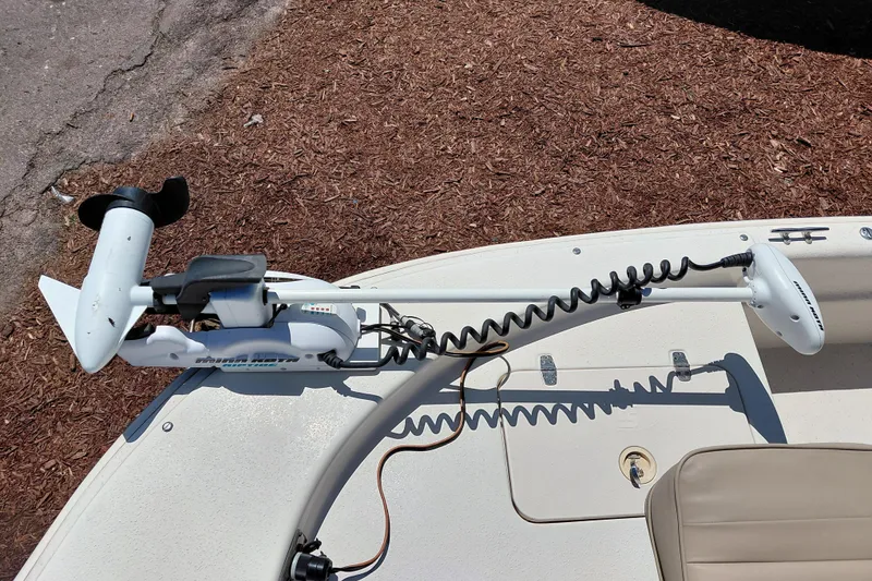 Slide: The Image of 2017 Carolina Skiff 18 JVX CC boat with trolling motor on deck. - 12