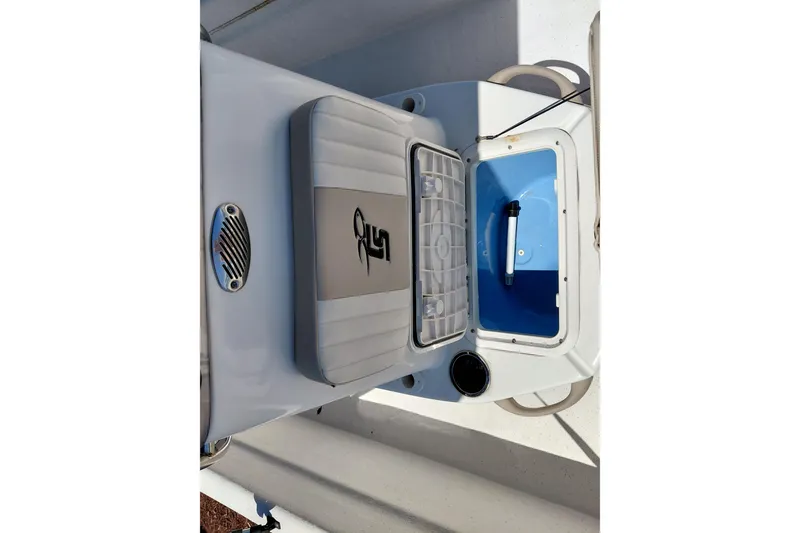 Slide: The Image of 2017 Carolina Skiff 18 JVX CC boat interior with open storage compartment and seating. - 16