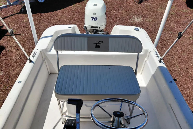Slide: The Image of 2017 Carolina Skiff 18 JVX CC boat interior with steering wheel and seating. - 17