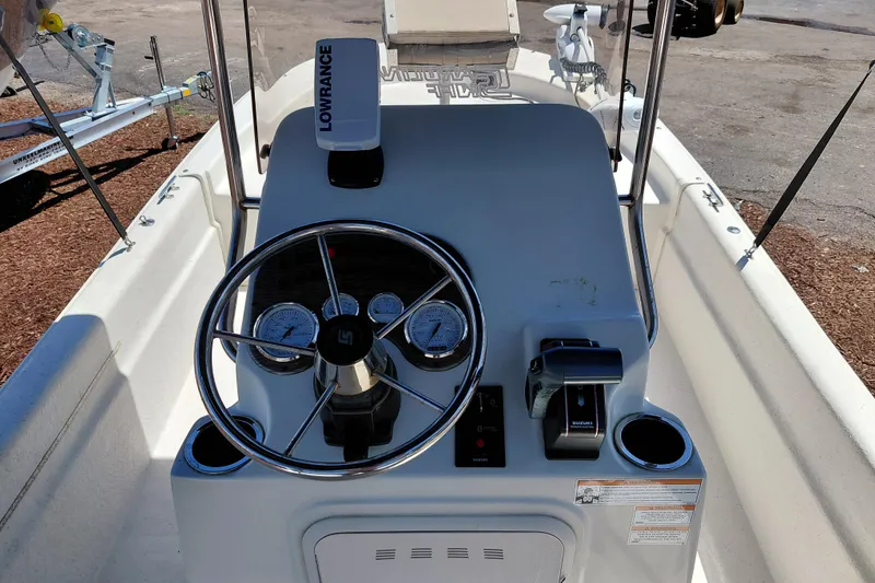Slide: The Image of 2017 Carolina Skiff 18 JVX CC boat console with steering wheel and gauges. - 20