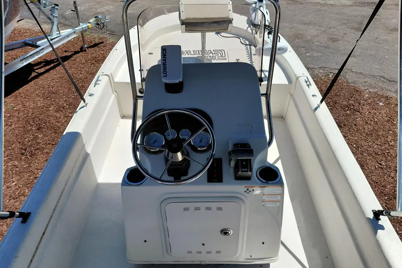 Slide: The Image of 2017 Carolina Skiff 18 JVX CC boat console with steering wheel and navigation equipment. - 21