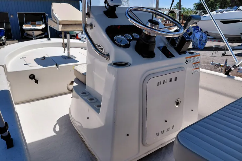 Slide: The Image of 2017 Carolina Skiff 18 JVX CC boat interior with steering console and seating. - 30