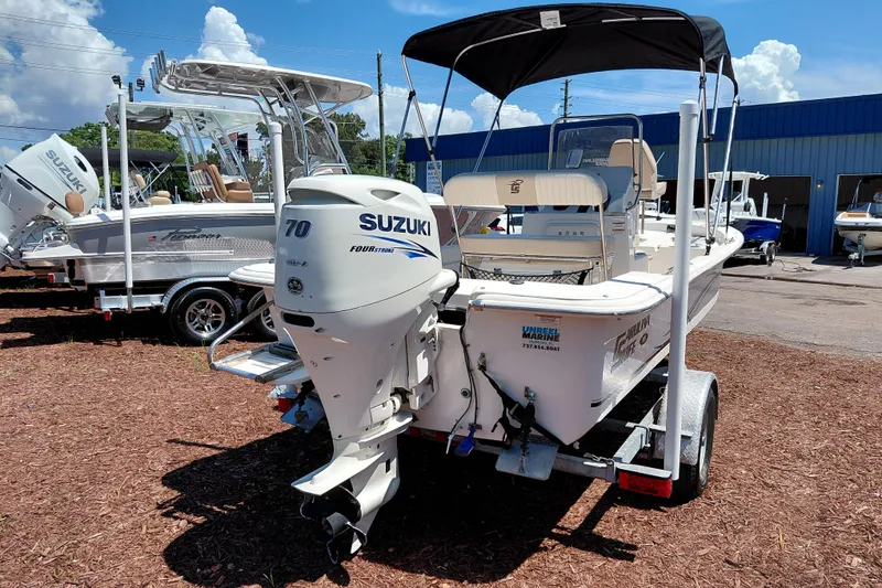 Slide: The Image of 2017 Carolina Skiff 18 JVX CC boat with Suzuki 70 outboard motor on trailer. - 7