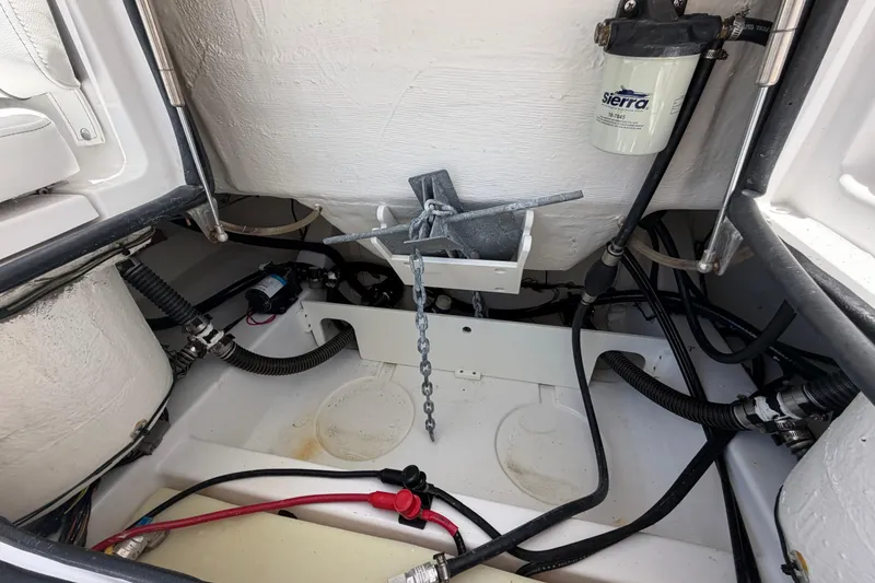 Slide: The Image of 2022 Sportsman Heritage 231 Center Console anchor storage and wiring compartment. - 19