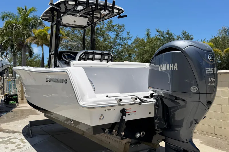 Slide: The Image of 2022 Sportsman Heritage 231 Center Console boat with Yamaha 250 V6 engine. - 2