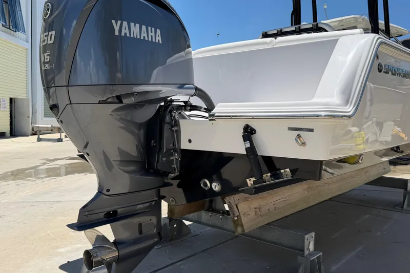 Slide: The Image of 2022 Sportsman Heritage 231 Center Console with Yamaha outboard motor in a marina setting. - 3